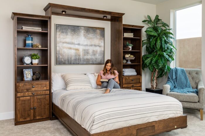 woman reading a book in a wall bed