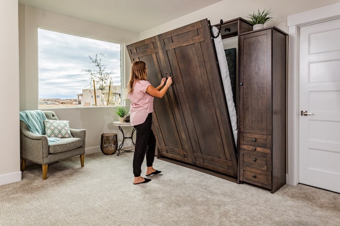 woman opening murphy bed