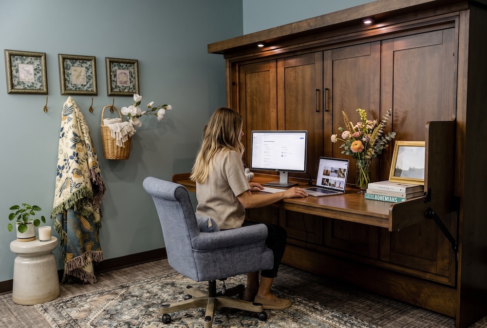 woman on a murphy desk bed